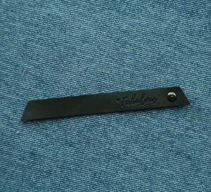 Kulit nipis cetakan timbul Label Trim